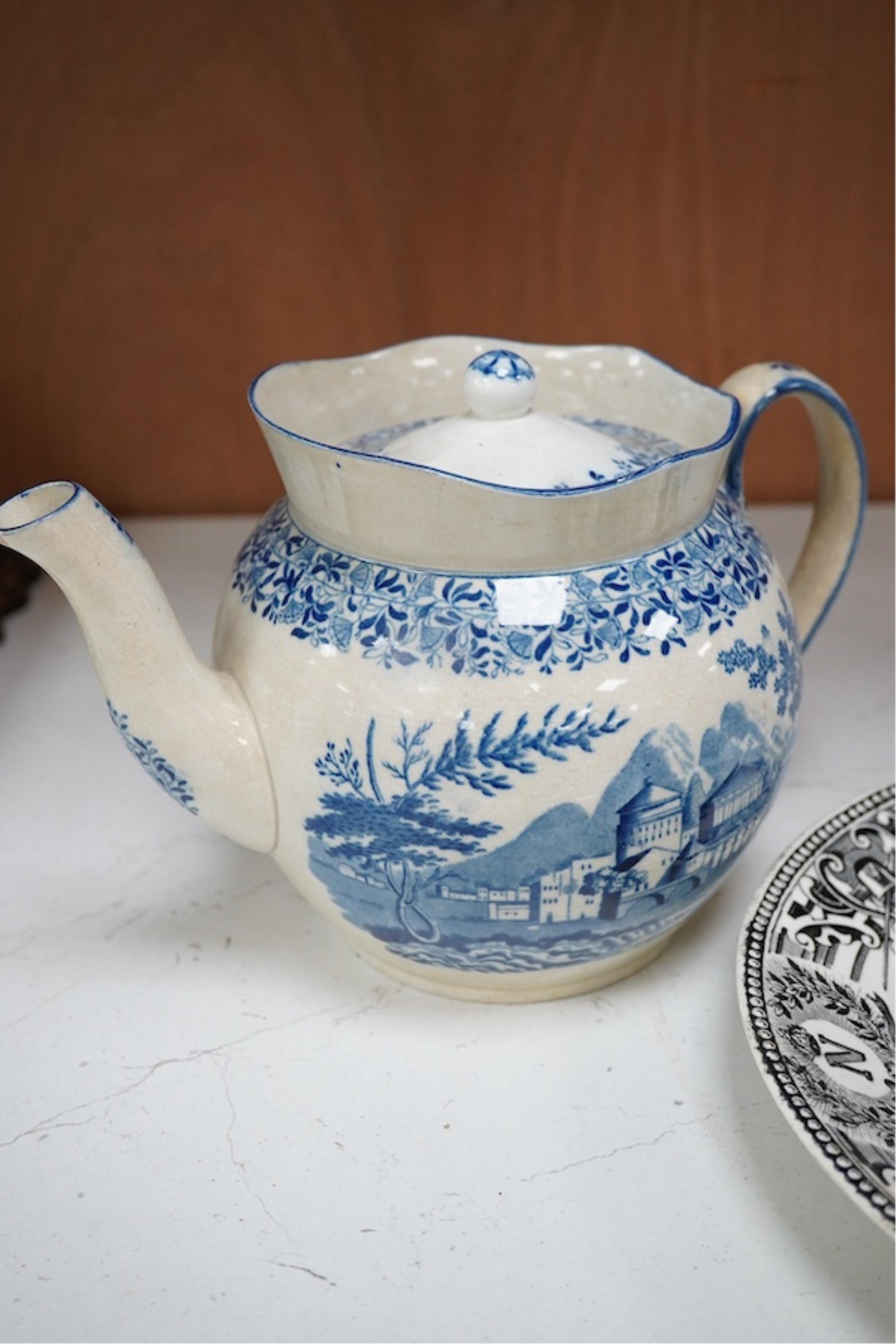 A mid 19th century pearlware teapot, a moustache mug and cover, two chinoiserie tiles and a Napoleon black and white transfer dish, Madrid 1808. Teapot and cover 16cm high. Condition - tile and teapot spout chipped